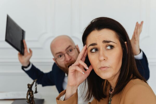 A lady is ignoring the frustrated man