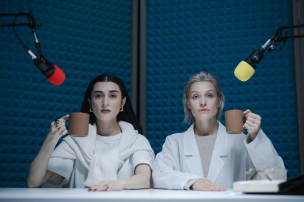 Two women are holding cups